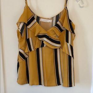 Yellow, black, and white striped Lush top